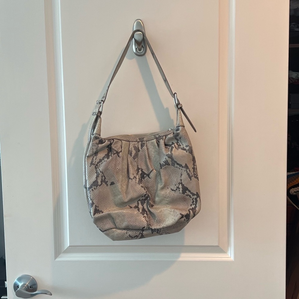 Calvin Klein Python-Look Leather Hobo Style
Handbag with Zipper.